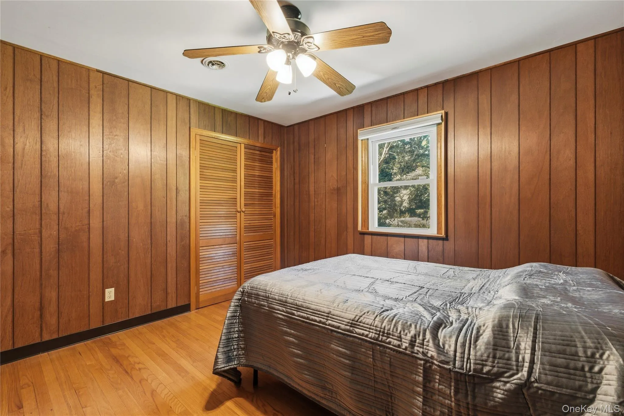 Wood-paneled walls and wood-finish flooring Wood-paneled walls and wood-finish flooring