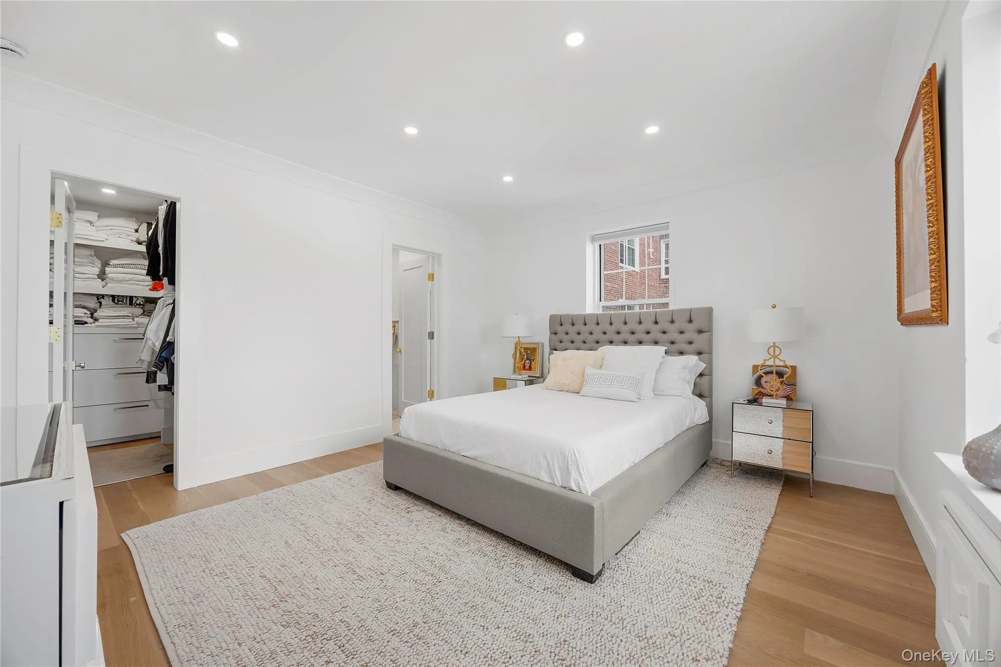 large primary bedroom with walk in closet fully outfitted large primary bedroom with walk in closet fully outfitted