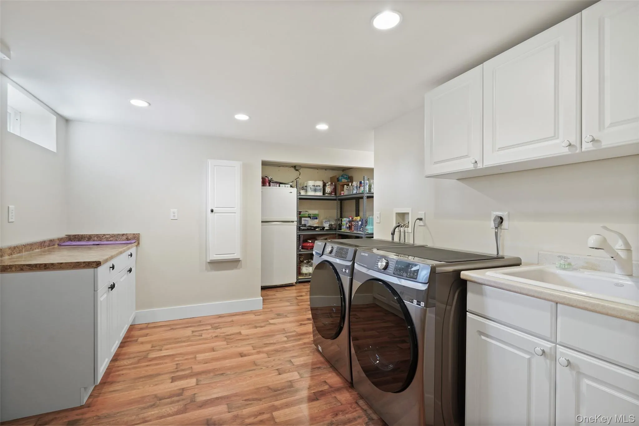 Dedicated laundry room with utility sink Dedicated laundry room with utility sink