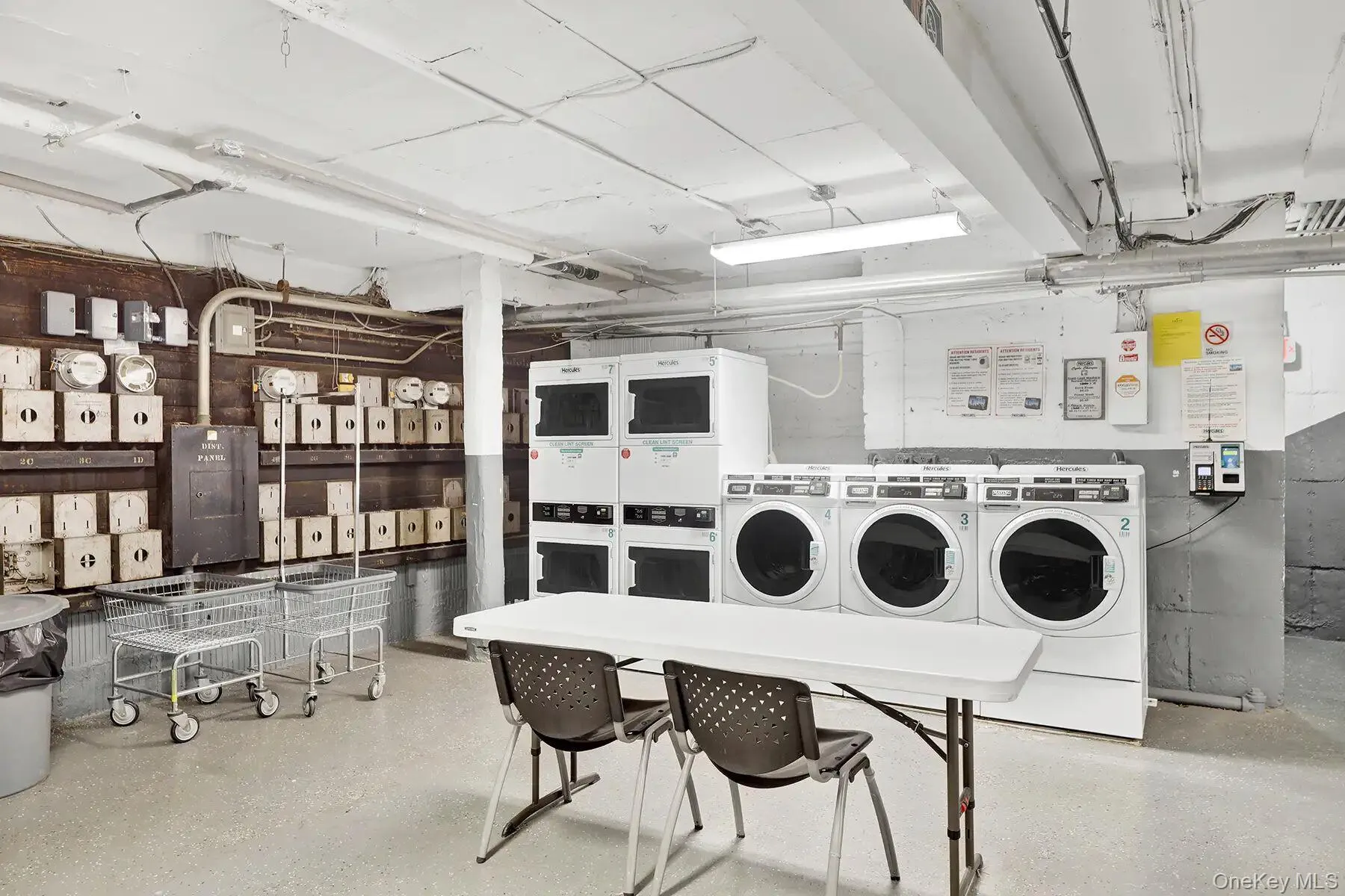 On-site laundry facility featuring multiple front-load washers and dryers On-site laundry facility featuring multiple front-load washers and dryers
