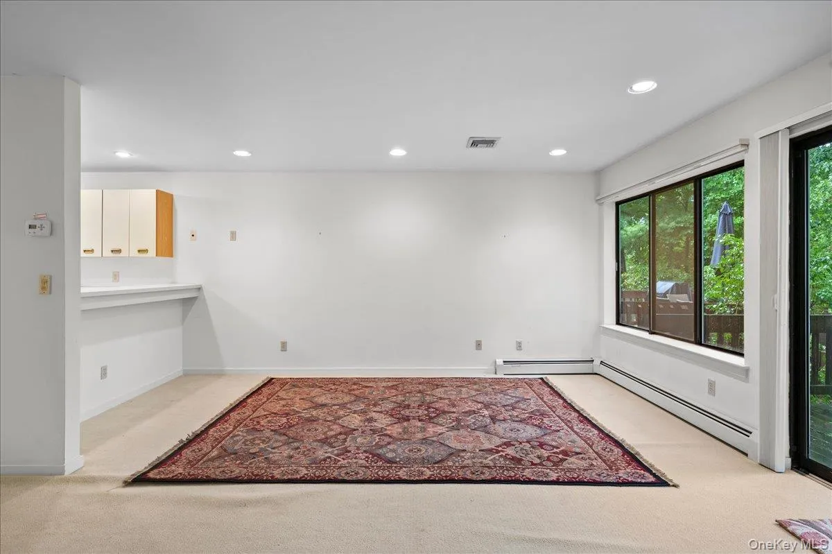 View of the large open living room with wall to wall windows View of the large open living room with wall to wall windows