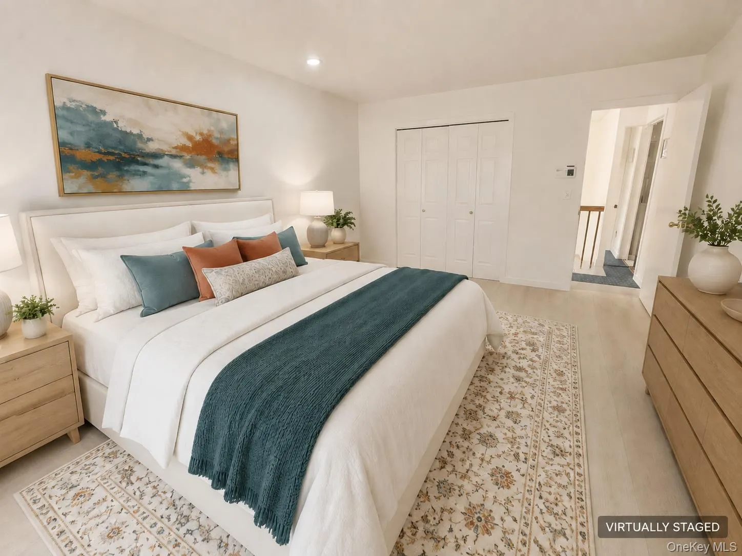 Over-sized Light wood-finish flooring, recessed lighting, and bi-fold closet doors Over-sized Light wood-finish flooring, recessed lighting, and bi-fold closet doors