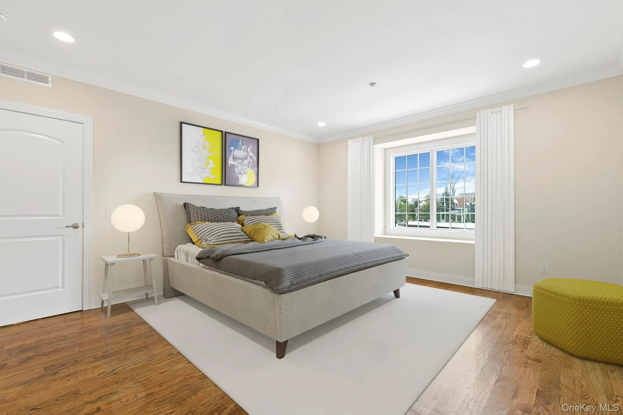 Virtually Staged - Primary Bedroom with ornamental molding and wood-type flooring Virtually Staged - Primary Bedroom with ornamental molding and wood-type flooring