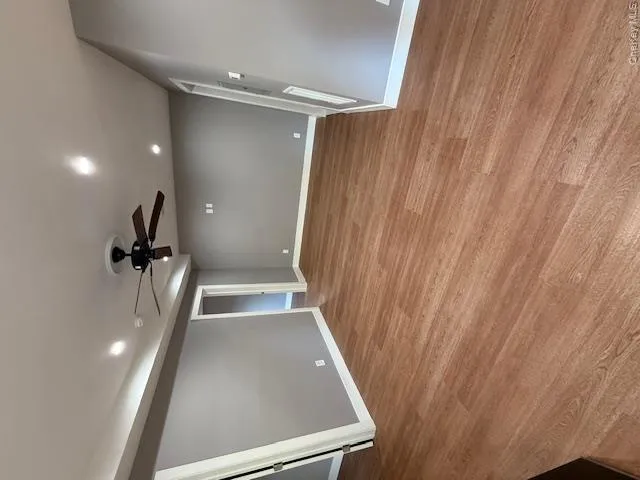 Spare room featuring a ceiling fan, recessed lighting, and light wood finished floors Spare room featuring a ceiling fan, recessed lighting, and light wood finished floors