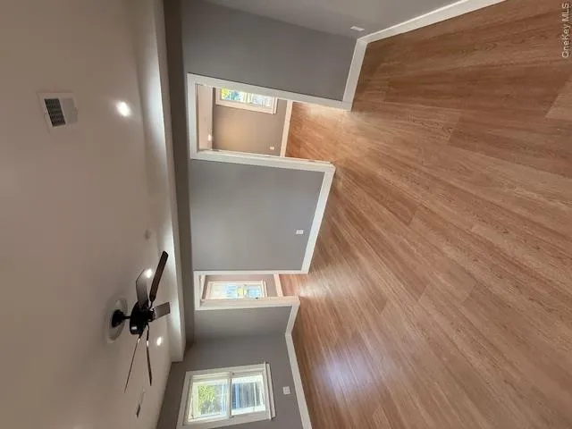 Unfurnished room featuring light wood finished floors, a ceiling fan, and recessed lighting Unfurnished room featuring light wood finished floors, a ceiling fan, and recessed lighting