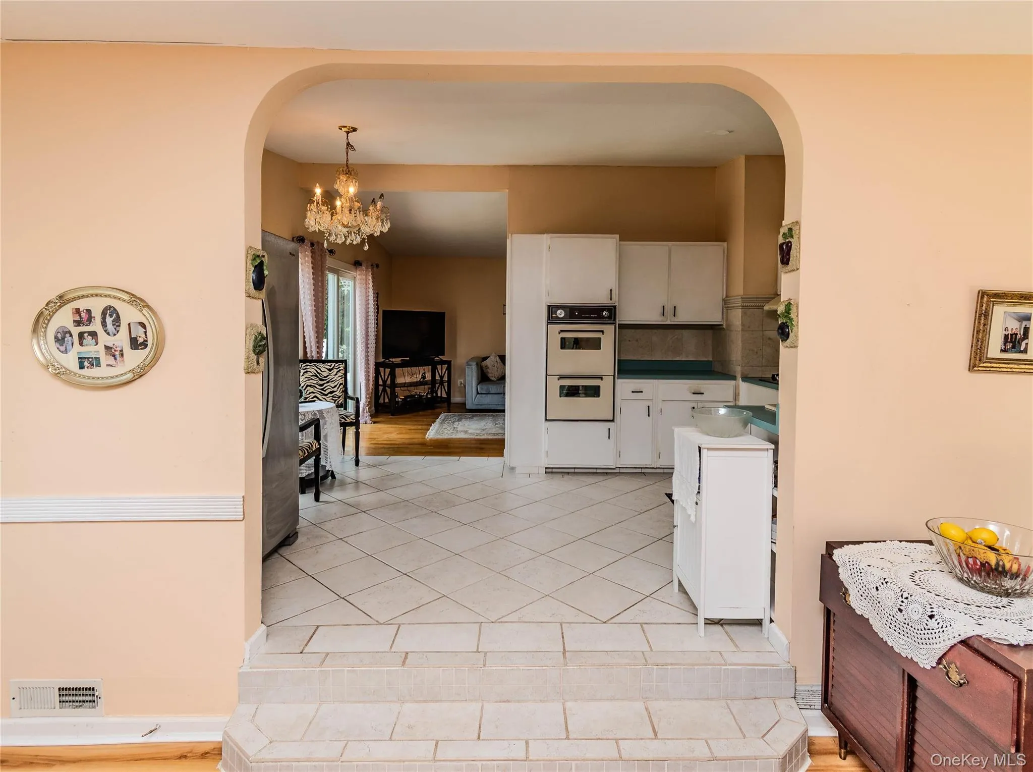 Tiled flooring, arched entryway, and steps with tile risers Tiled flooring, arched entryway, and steps with tile risers