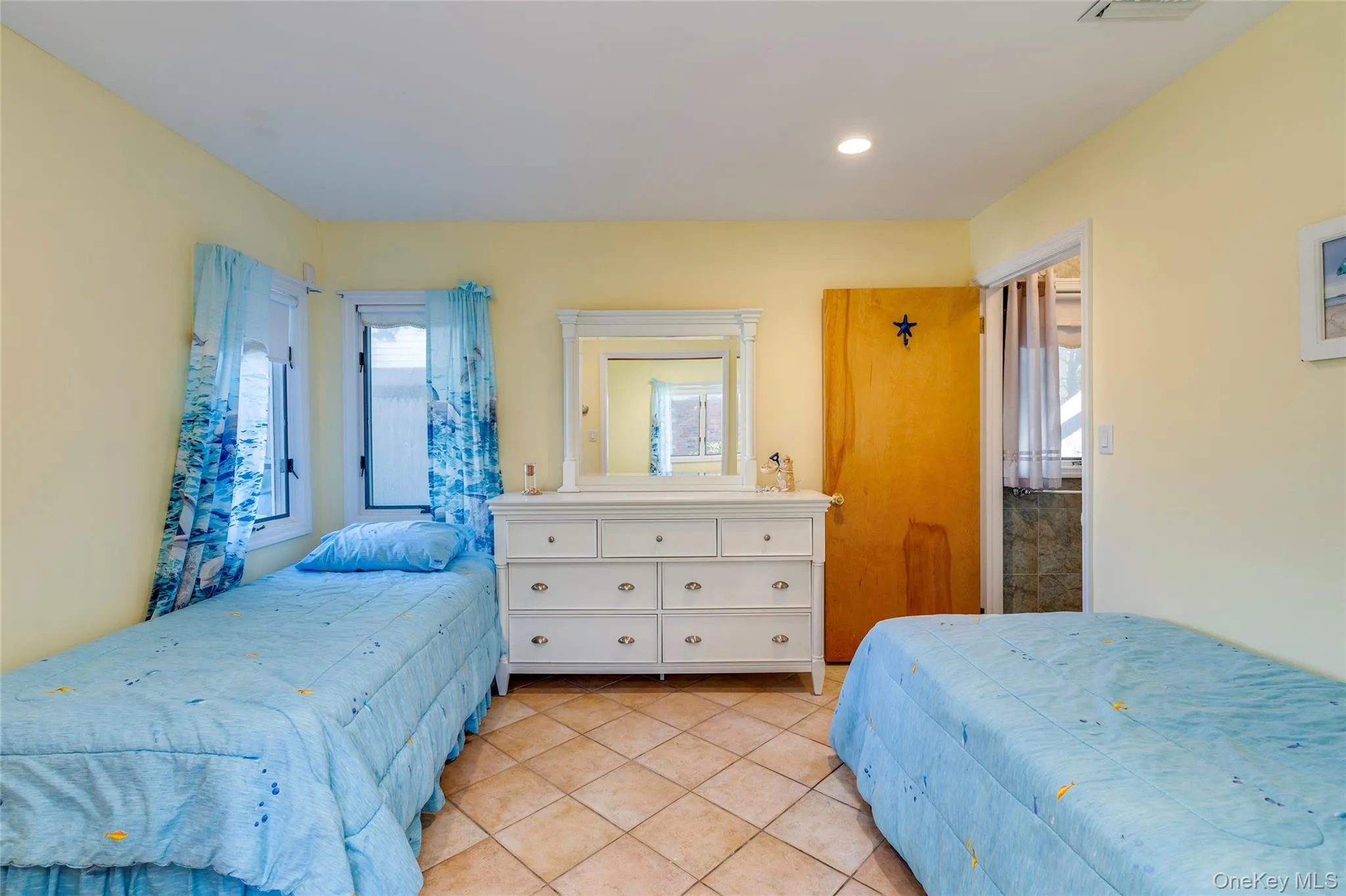Bedroom with 2 twin beds, tile floors, walk-in closet and ensuite 1/2 bath. Bedroom with 2 twin beds, tile floors, walk-in closet and ensuite 1/2 bath.