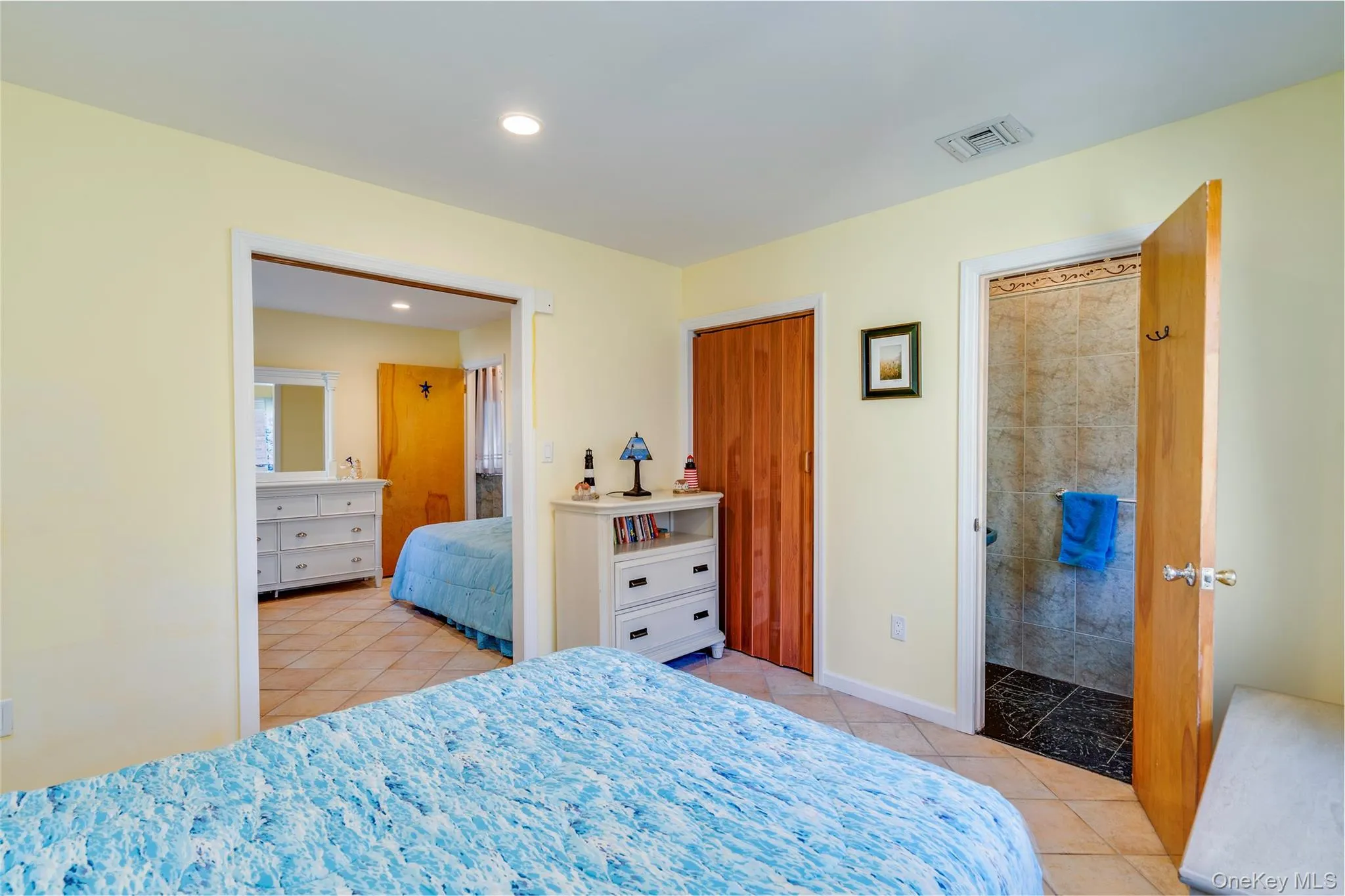 Bedroom with tile floors and access to stall shower, outside entrance and garage entrance. Bedroom is a walk-thru to access Bedroom 4. Bedroom with tile floors and access to stall shower, outside entrance and garage entrance. Bedroom is a walk-thru to access Bedroom 4.