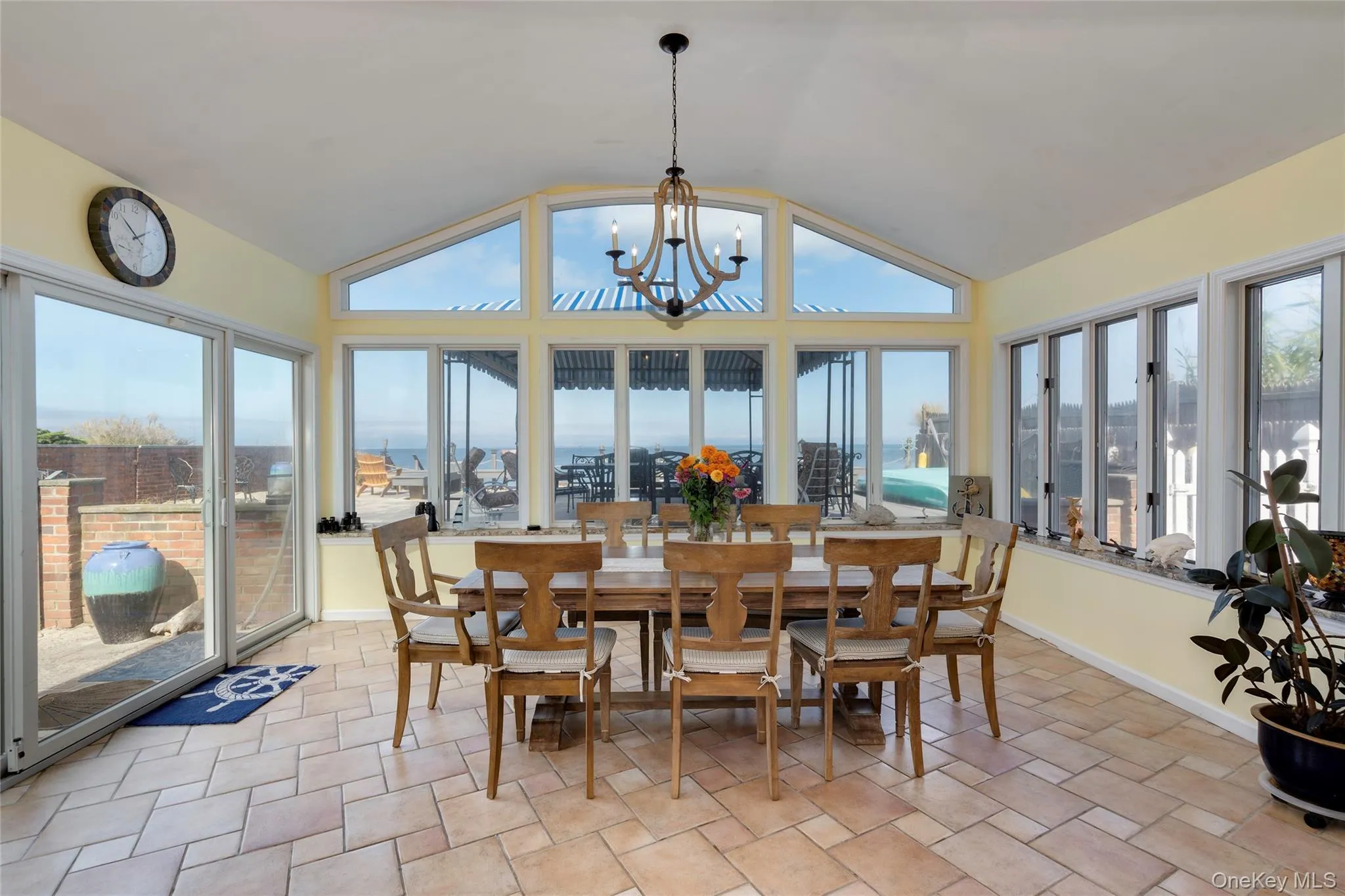 The dining area has walls of windows, surrounding you with natural light and stunning waterviews. The dining area has walls of windows, surrounding you with natural light and stunning waterviews.