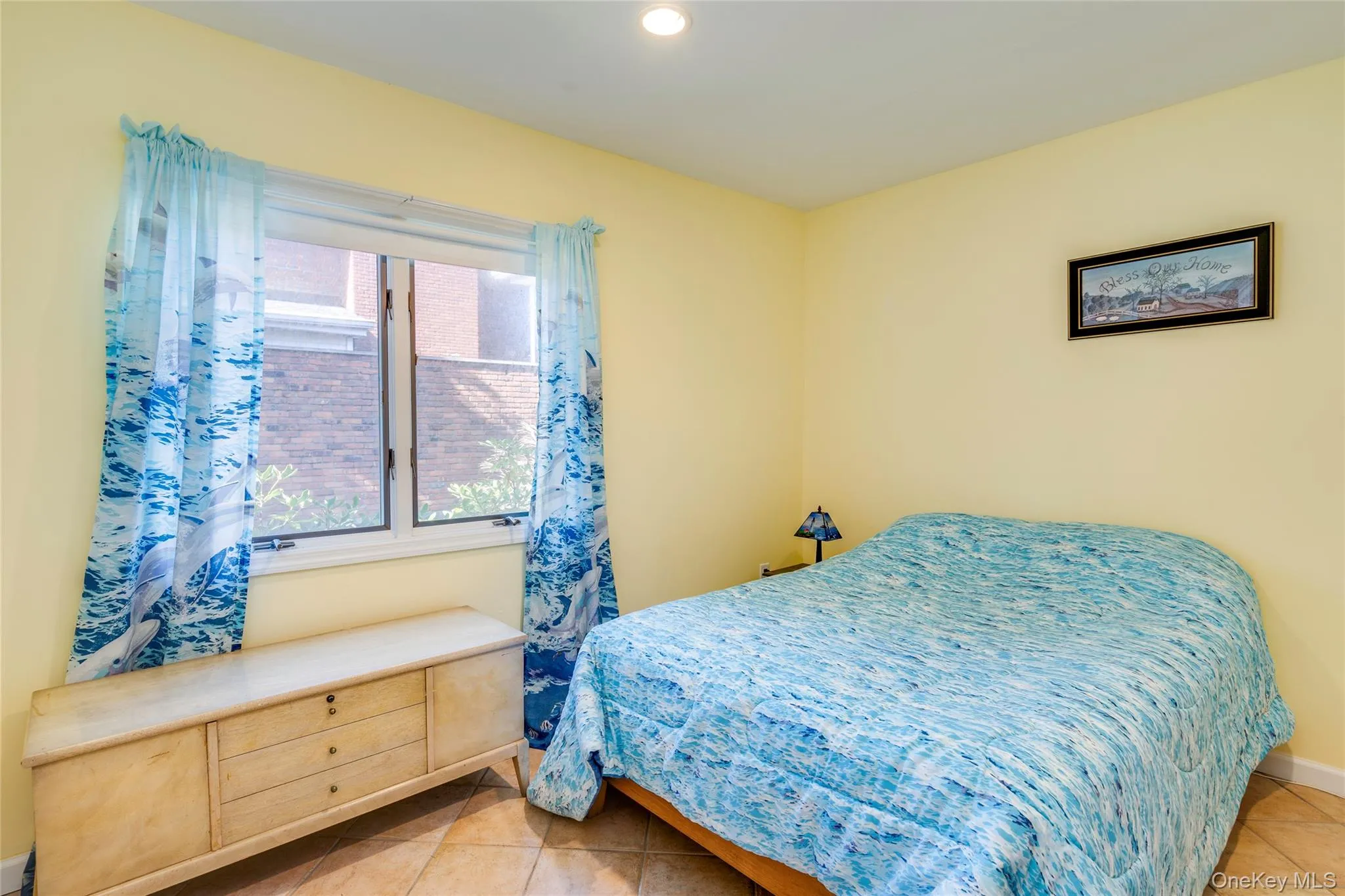 Bedroom with tile floors and access to stall shower, outside entrance and garage entrance. Bedroom is a walk-thru to access Bedroom 4. Bedroom with tile floors and access to stall shower, outside entrance and garage entrance. Bedroom is a walk-thru to access Bedroom 4.