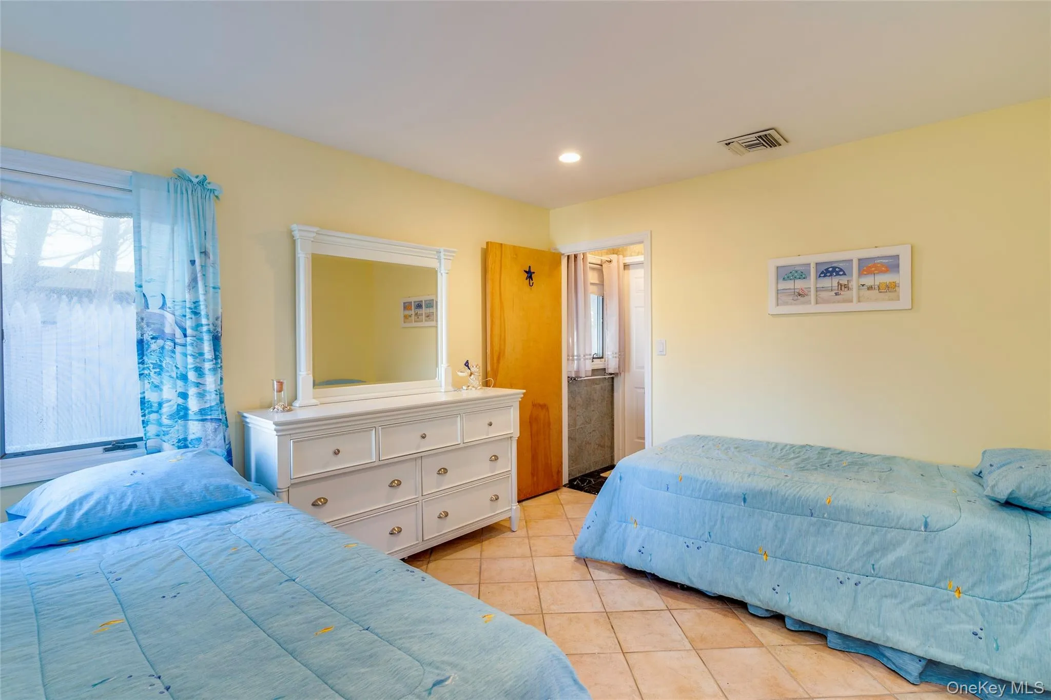 Bedroom with 2 twin beds, tile floors, walk-in closet and ensuite 1/2 bath. Bedroom with 2 twin beds, tile floors, walk-in closet and ensuite 1/2 bath.