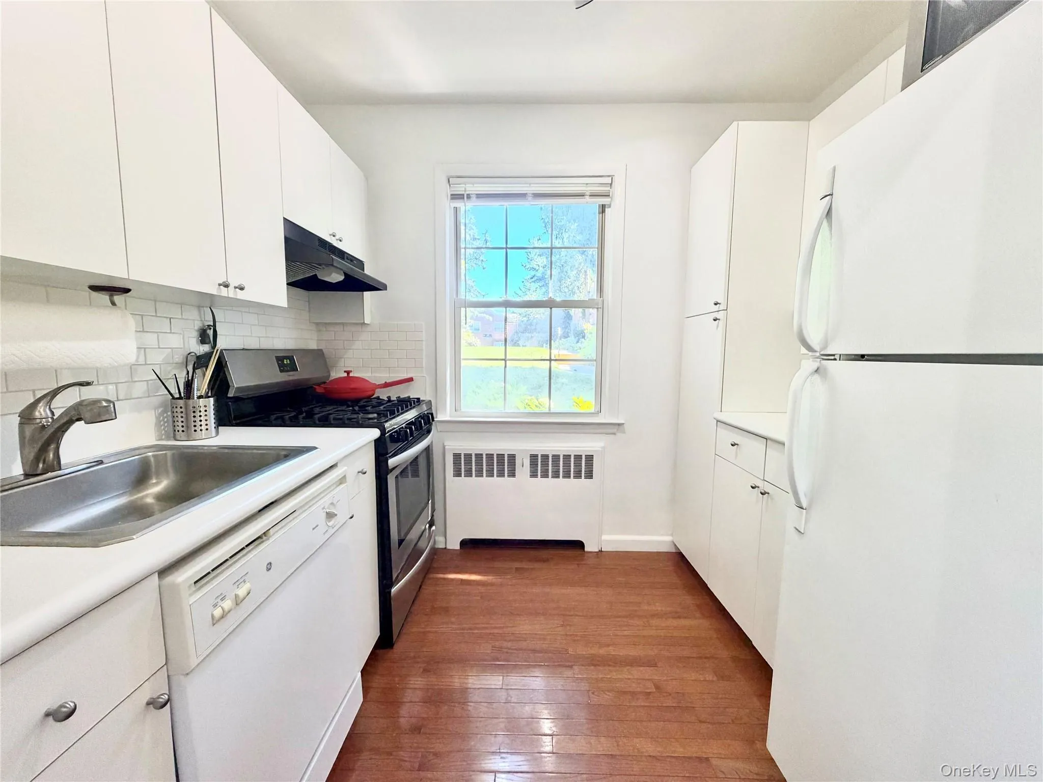 Galley-style kitchen with dishwasher. Galley-style kitchen with dishwasher.