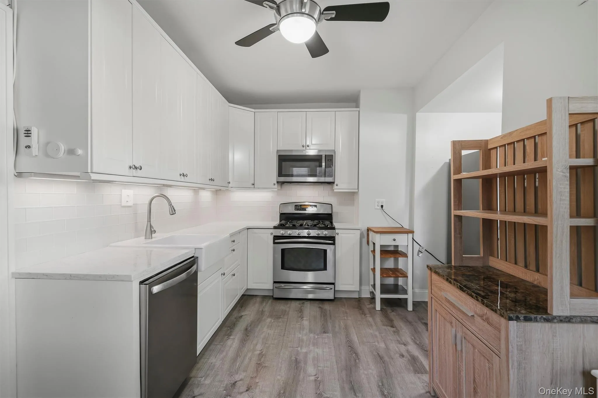 White cabinetry with subway tile backsplash White cabinetry with subway tile backsplash