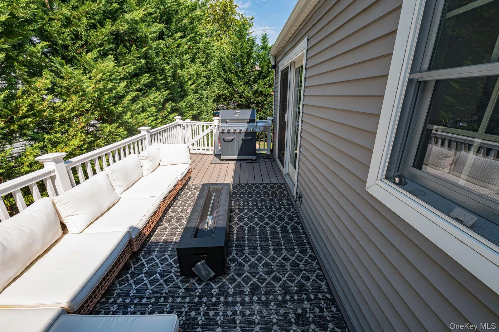 PVC and Trex deck leading to large yard. PVC and Trex deck leading to large yard.