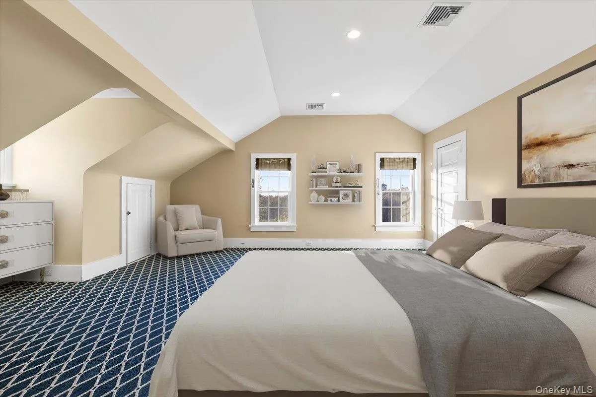 THIRD-LEVEL BEDROOM / FLEX SPACEExpansive upper-level room ideal as an additional bedroom, studio, playroom or creative space. THIRD-LEVEL BEDROOM / FLEX SPACEExpansive upper-level room ideal as an additional bedroom, studio, playroom or creative space.