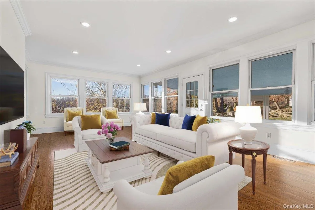 FAMILY ROOMSun-filled family room surrounded by windows captures beautiful views across the estate grounds. FAMILY ROOMSun-filled family room surrounded by windows captures beautiful views across the estate grounds.