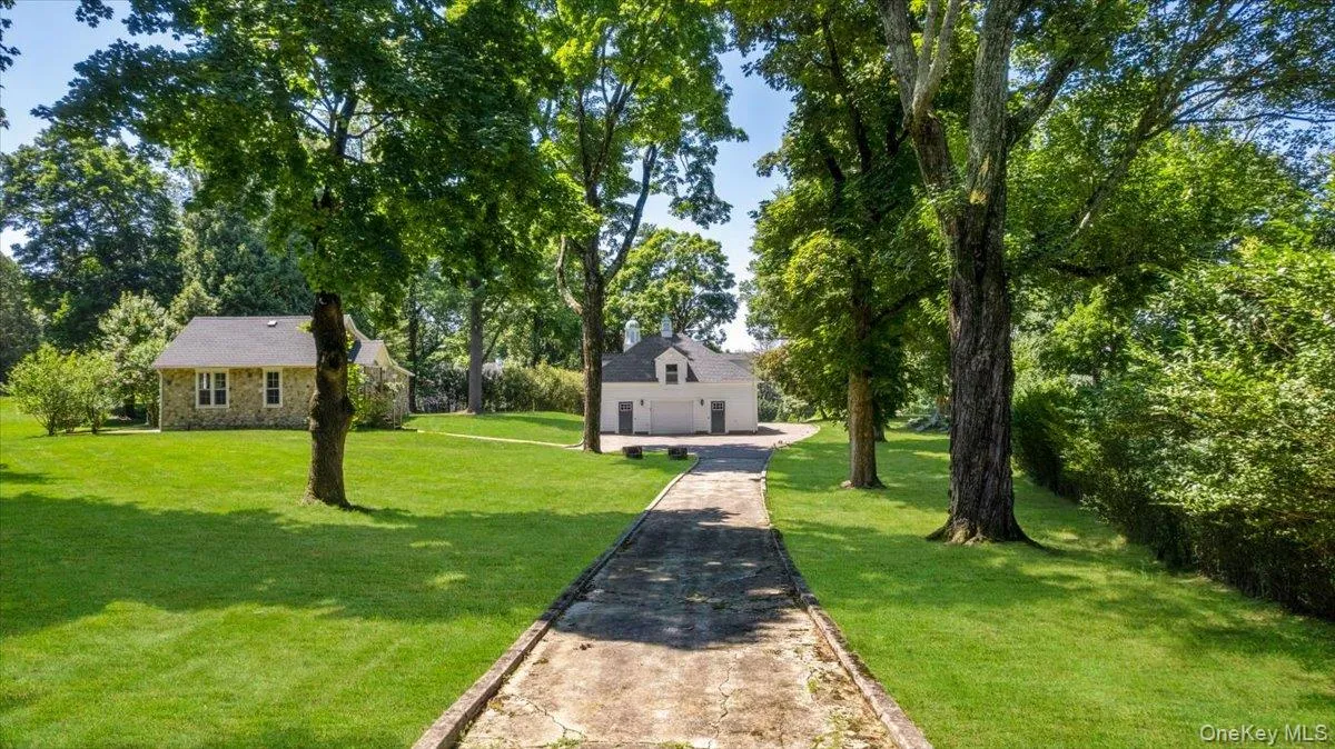 TREE-LINED ESTATE DRIVEA picturesque tree-lined drive winds through the beautifully established estate grounds. TREE-LINED ESTATE DRIVEA picturesque tree-lined drive winds through the beautifully established estate grounds.