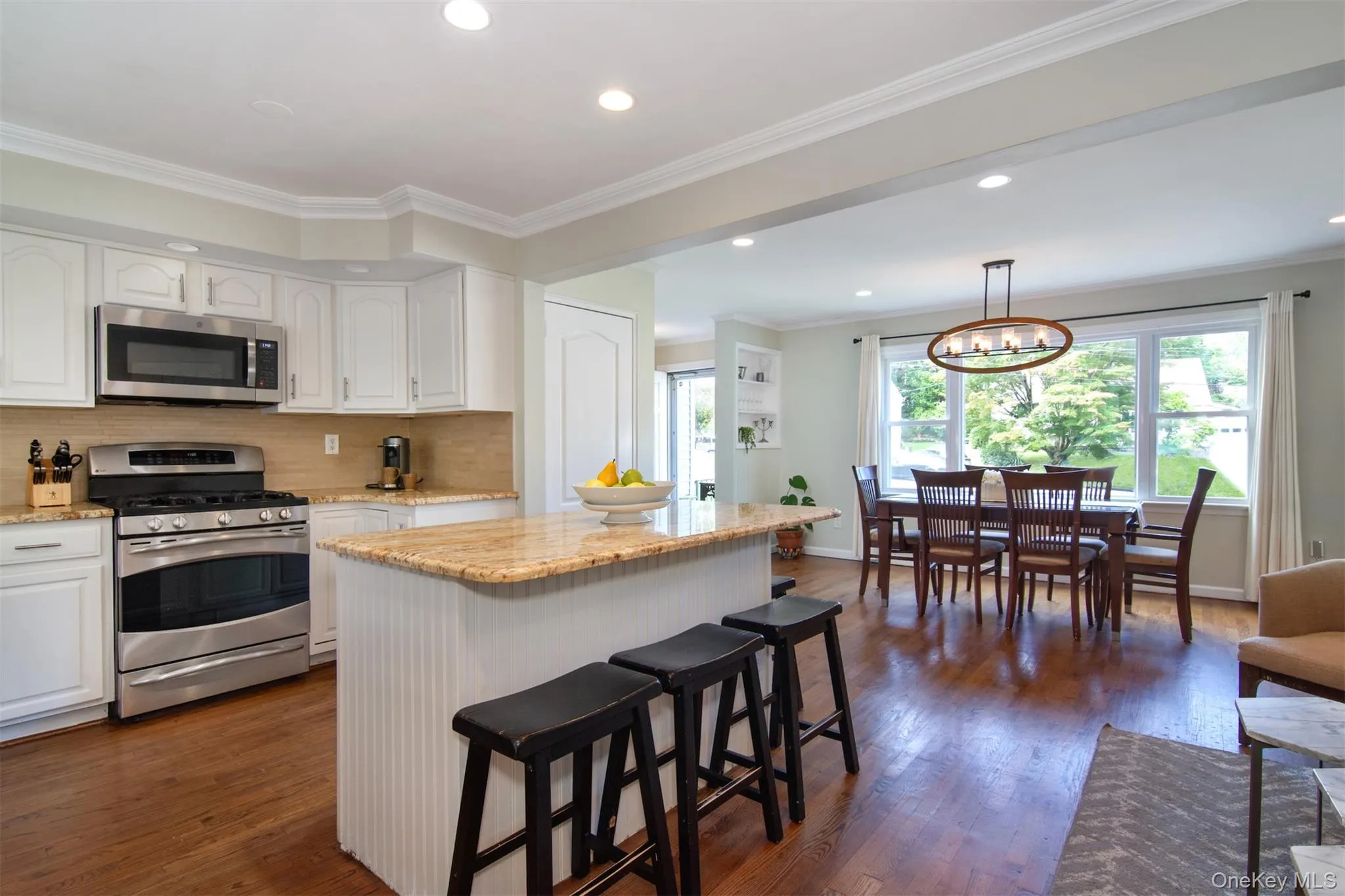 Dining, kitchen and living area Dining, kitchen and living area