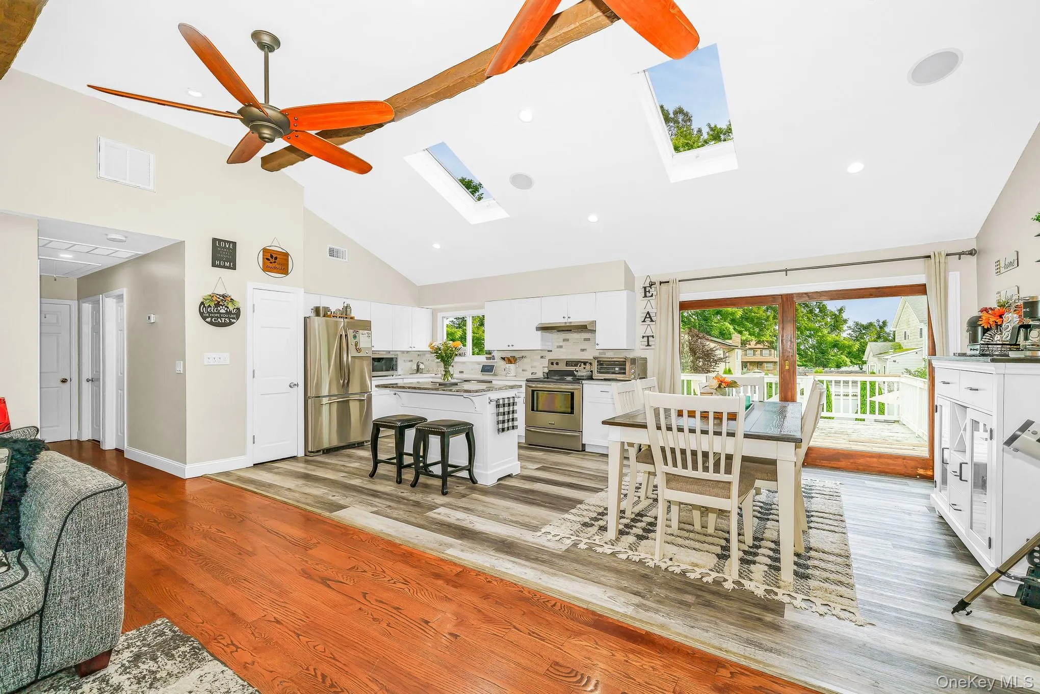 Vaulted ceilings with exposed beams, two skylights, and recessed lighting Vaulted ceilings with exposed beams, two skylights, and recessed lighting