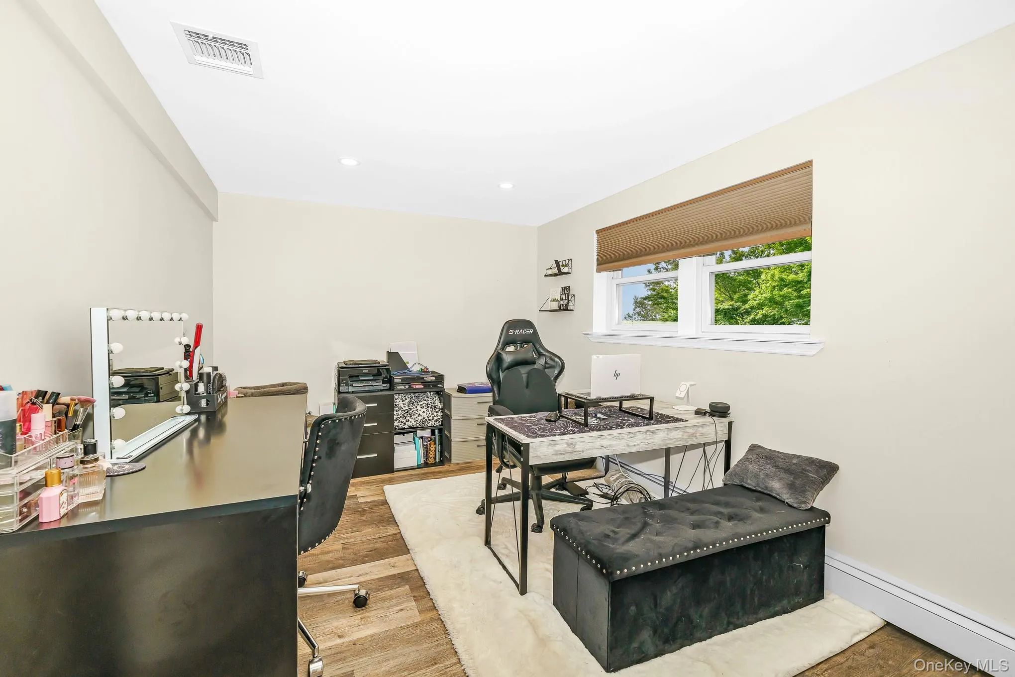 Office or Bedroom with Recessed lighting, wood-finish flooring, and a window with a roller shade and a large closet Office or Bedroom with Recessed lighting, wood-finish flooring, and a window with a roller shade and a large closet