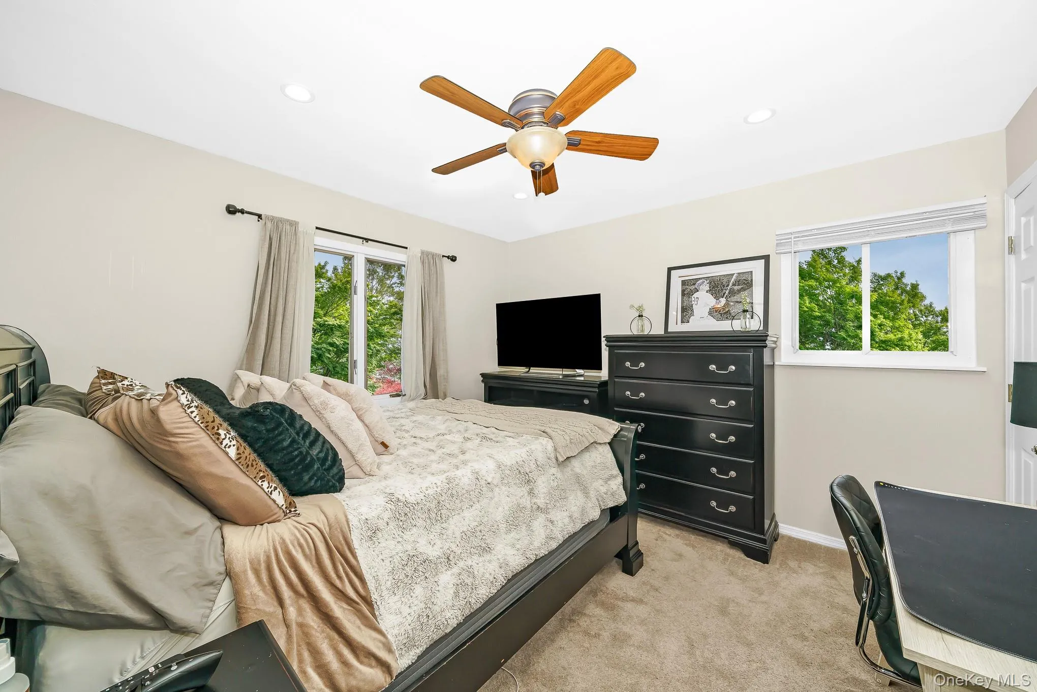 Wall-to-wall carpeting, recessed lighting, and a ceiling fan with light fixture Wall-to-wall carpeting, recessed lighting, and a ceiling fan with light fixture