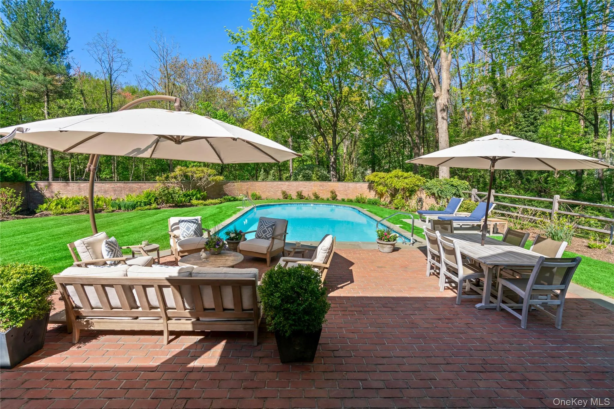 View of outdoordining space and patio next to the gunite swimming pool. View of outdoordining space and patio next to the gunite swimming pool.