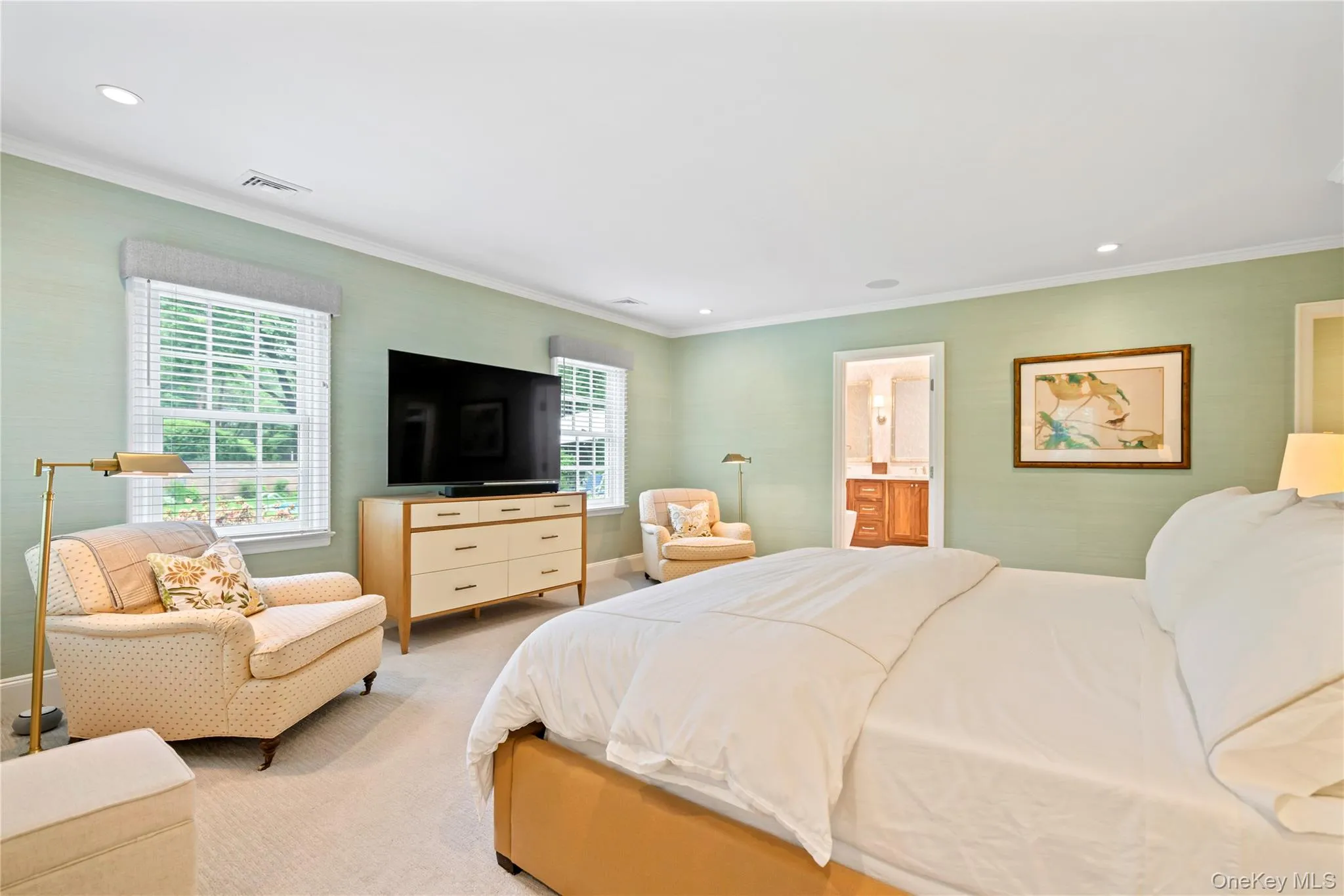 Primary main floor Bedroom with sitting area and en-suite bathroom with en-suite bathroom. Primary main floor Bedroom with sitting area and en-suite bathroom with en-suite bathroom.