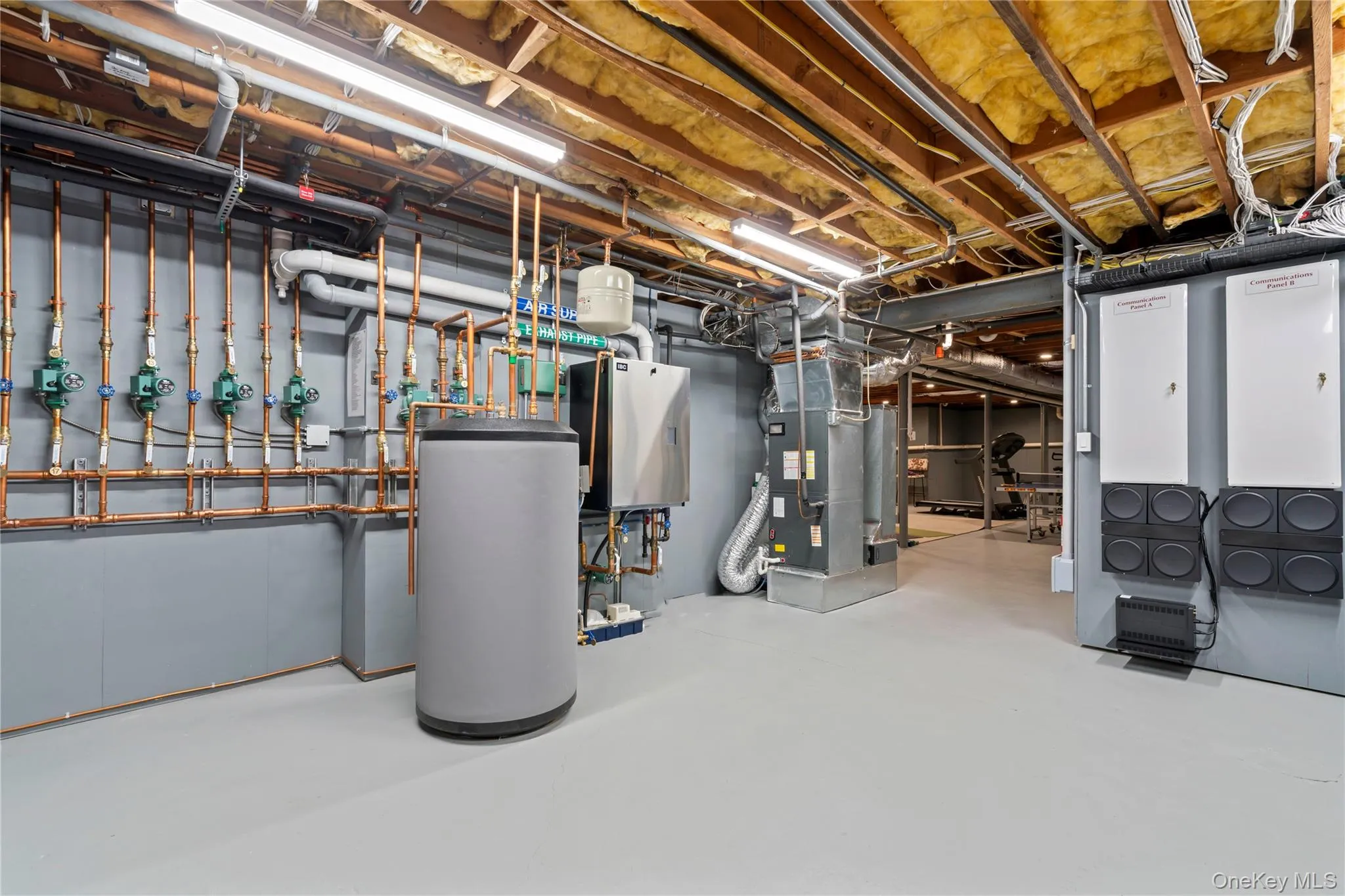Unfinished Section of Lower Level featuring State-of-the-Art Systems and full House Generator, Water Heater and Heating Unit. Unfinished Section of Lower Level featuring State-of-the-Art Systems and full House Generator, Water Heater and Heating Unit.
