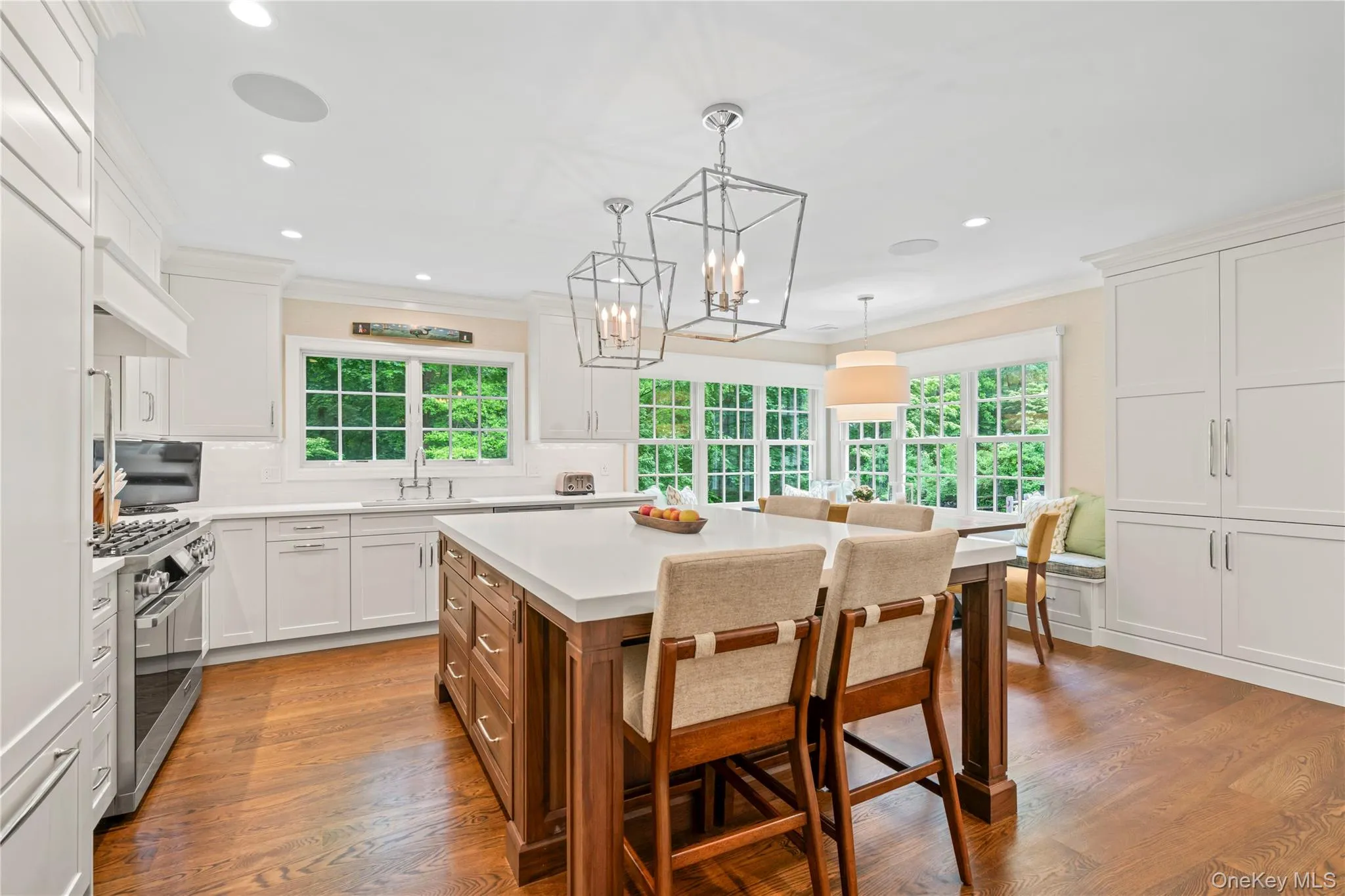 Light filled gourmet Kitchen with seating around the island. Light filled gourmet Kitchen with seating around the island.