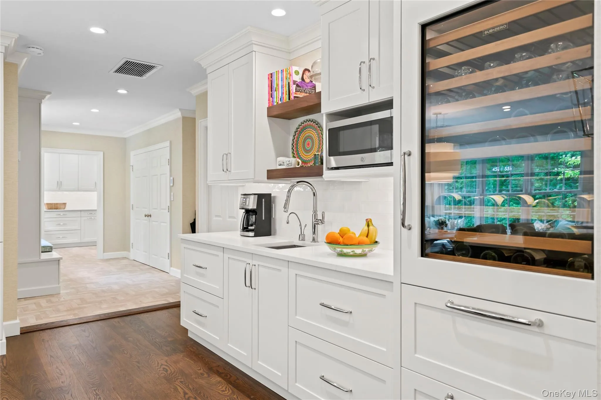 Kitchen with 135-bottle Sub-Zero wine storage with refrigerator drawers. Kitchen with 135-bottle Sub-Zero wine storage with refrigerator drawers.