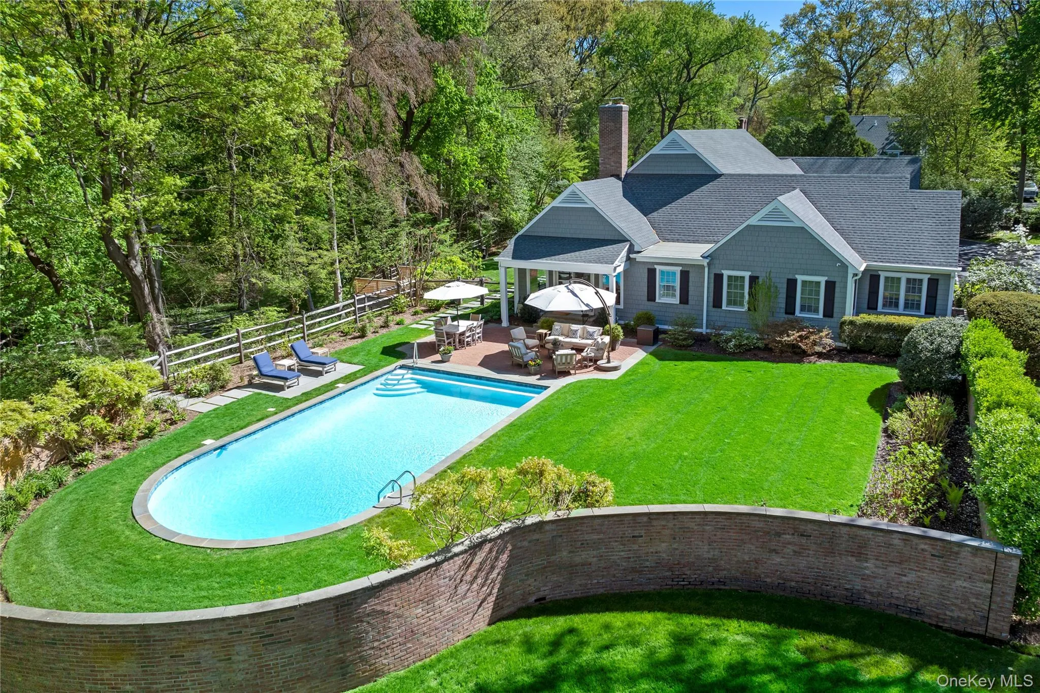 Outdoor dining area and patio next to a 20 x 38 gunite heated pool with bluestone coping, Jandy smart controls and a natural gas heater. Outdoor dining area and patio next to a 20 x 38 gunite heated pool with bluestone coping, Jandy smart controls and a natural gas heater.