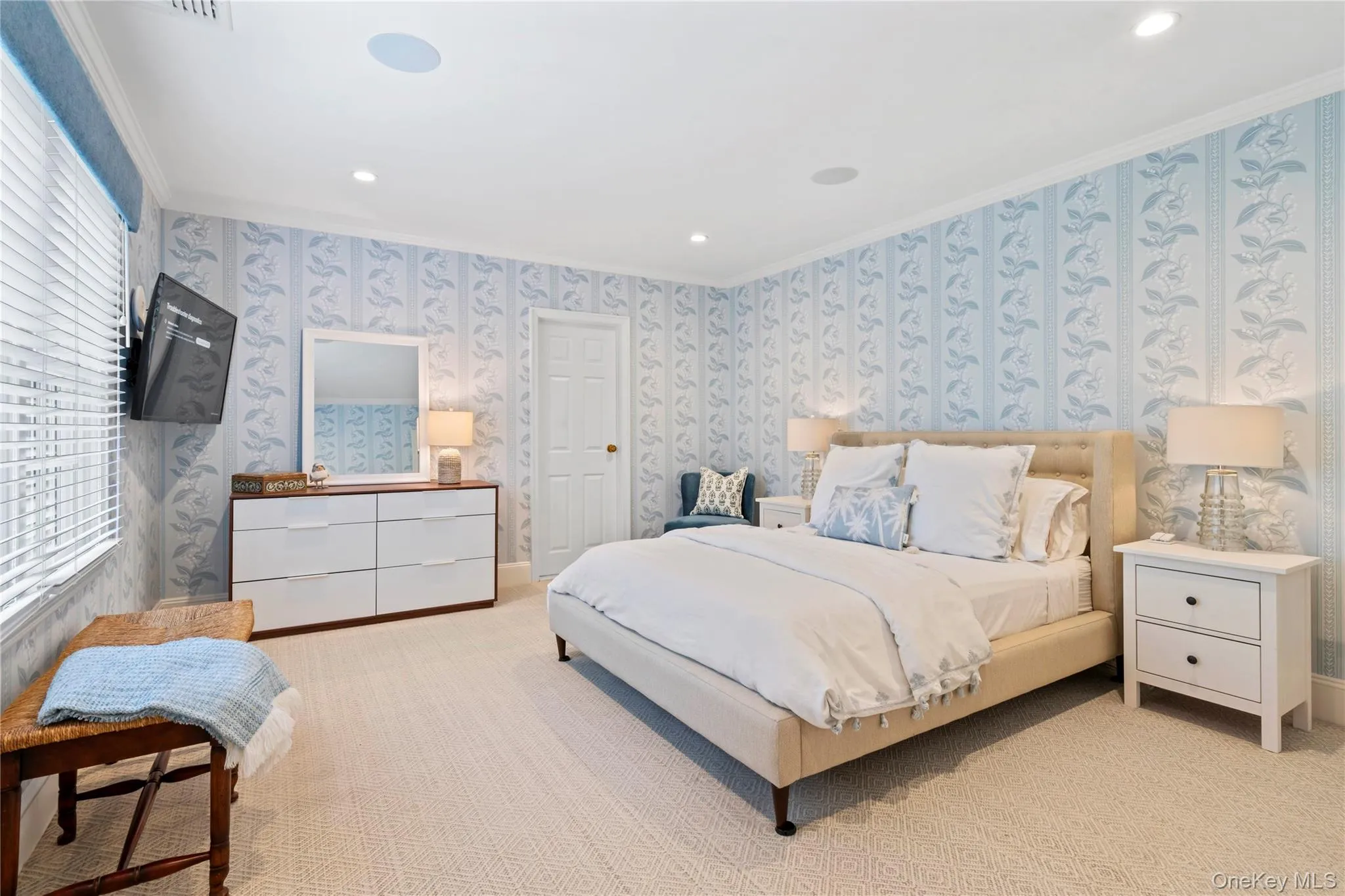 Main floor guest bedroom off the entrance foyer with en-suite bathroom. Main floor guest bedroom off the entrance foyer with en-suite bathroom.