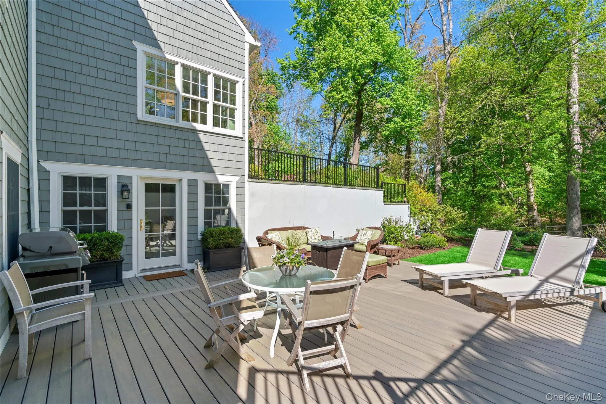 Lower level Wooden Deck featuring Outdoor Entertaining Space. Lower level Wooden Deck featuring Outdoor Entertaining Space.
