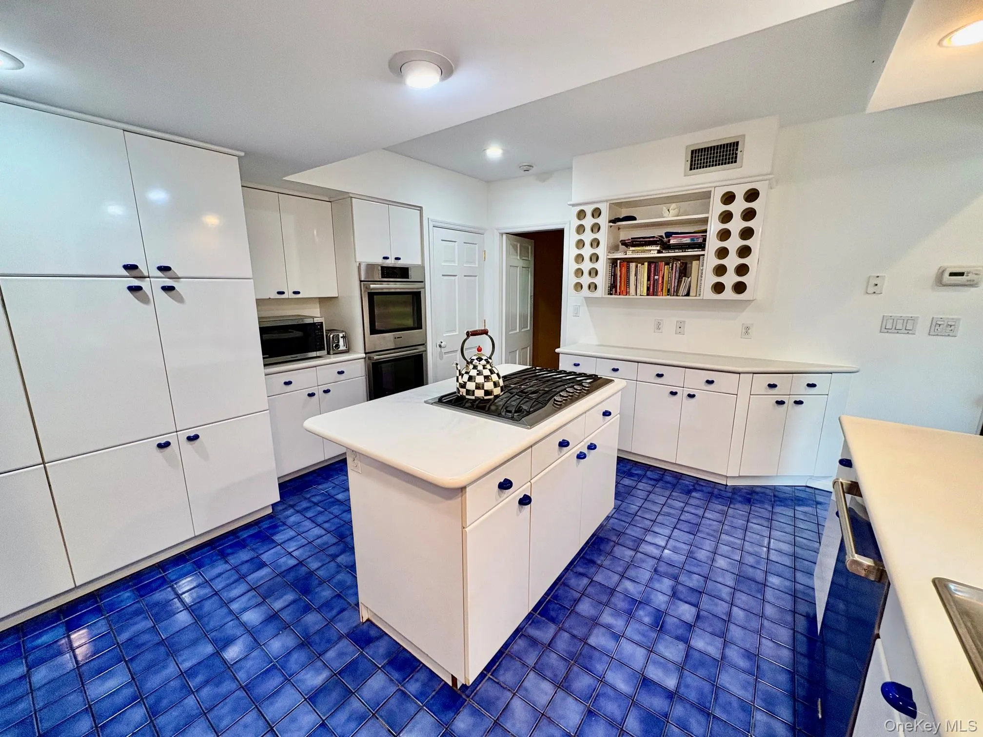 Center island with Viking cooktop and Corian countertops Center island with Viking cooktop and Corian countertops