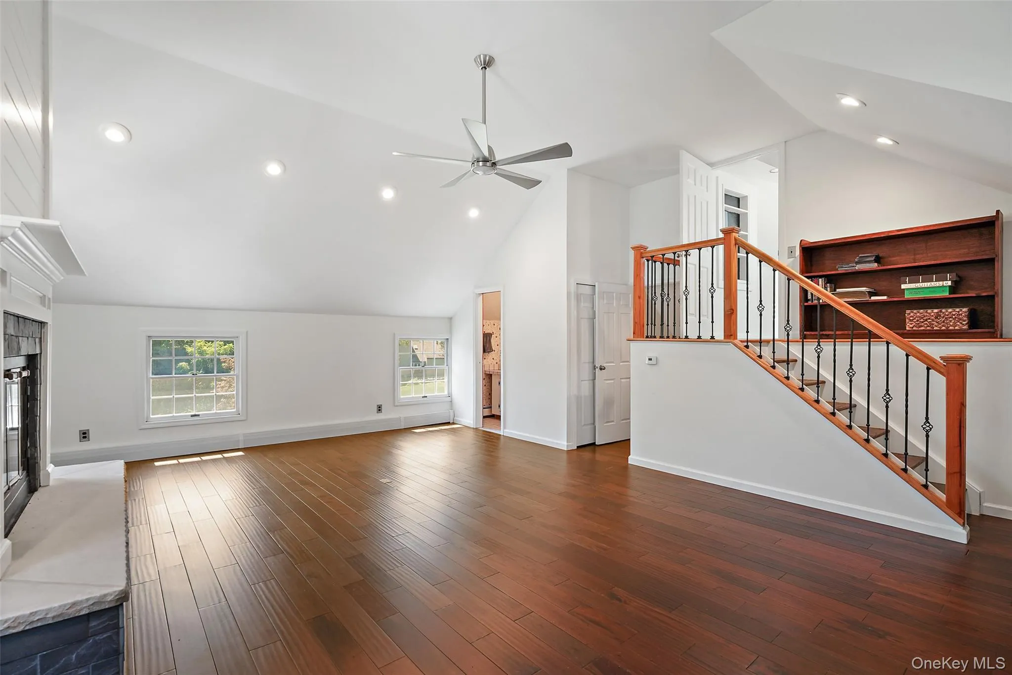 Alternate view of additional family room with half-bathroom in corner and stairs to small office off the Primary Bedroom. Alternate view of additional family room with half-bathroom in corner and stairs to small office off the Primary Bedroom.