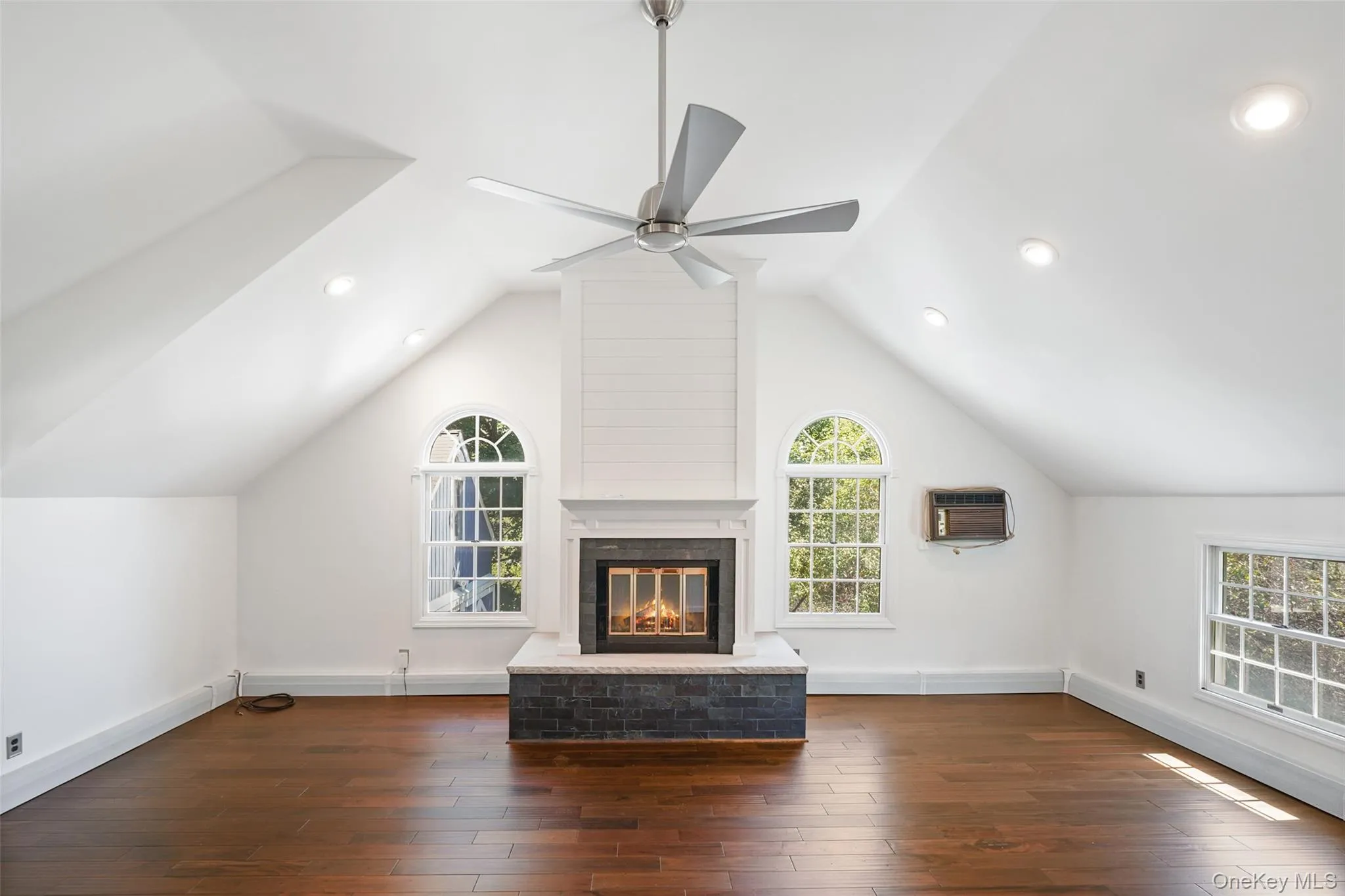 Beautifully renovated additional family room above the garage with cathedral ceiling, hardwood floors, wood burning fireplace and half-bathroom. Beautifully renovated additional family room above the garage with cathedral ceiling, hardwood floors, wood burning fireplace and half-bathroom.