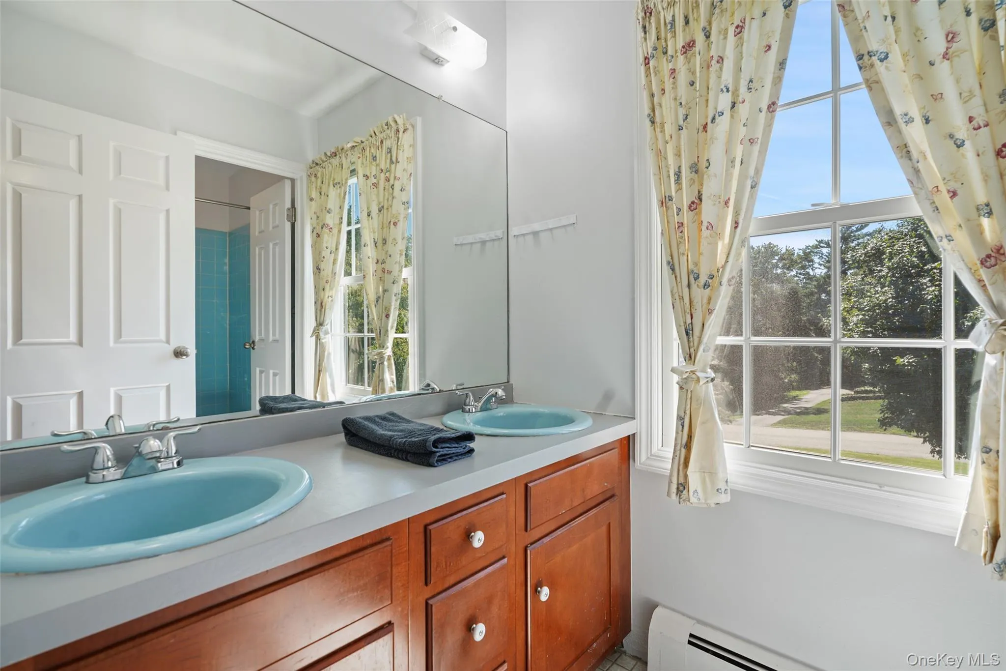 Upstairs hall bathroom with double vanity. Upstairs hall bathroom with double vanity.
