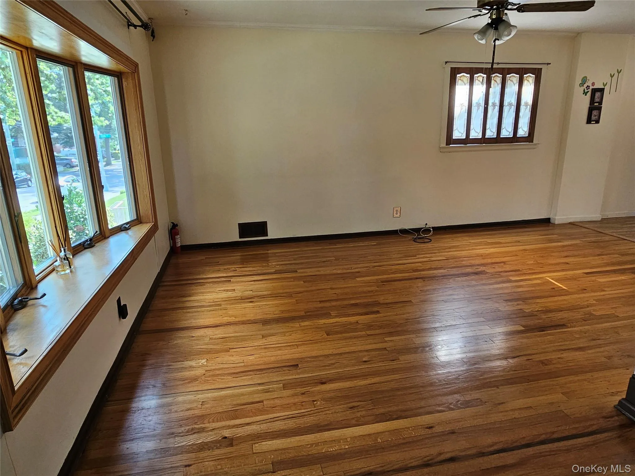 Living room with bay windows for extra natural light. House is facing south. (Currently being painted. New pictures coming soon) Living room with bay windows for extra natural light. House is facing south. (Currently being painted. New pictures coming soon)