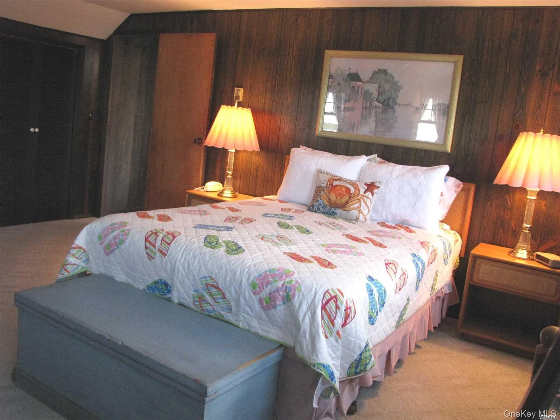 Carpeted bedroom featuring wood walls Carpeted bedroom featuring wood walls