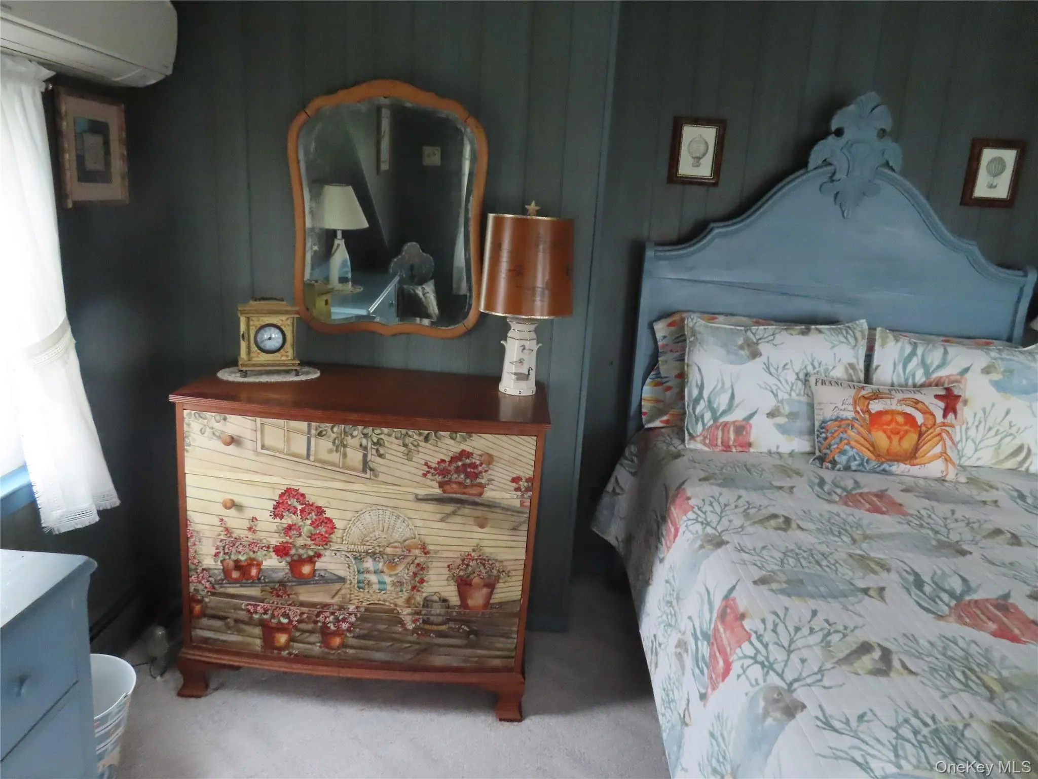 Carpeted bedroom featuring a wall mounted air conditioner Carpeted bedroom featuring a wall mounted air conditioner