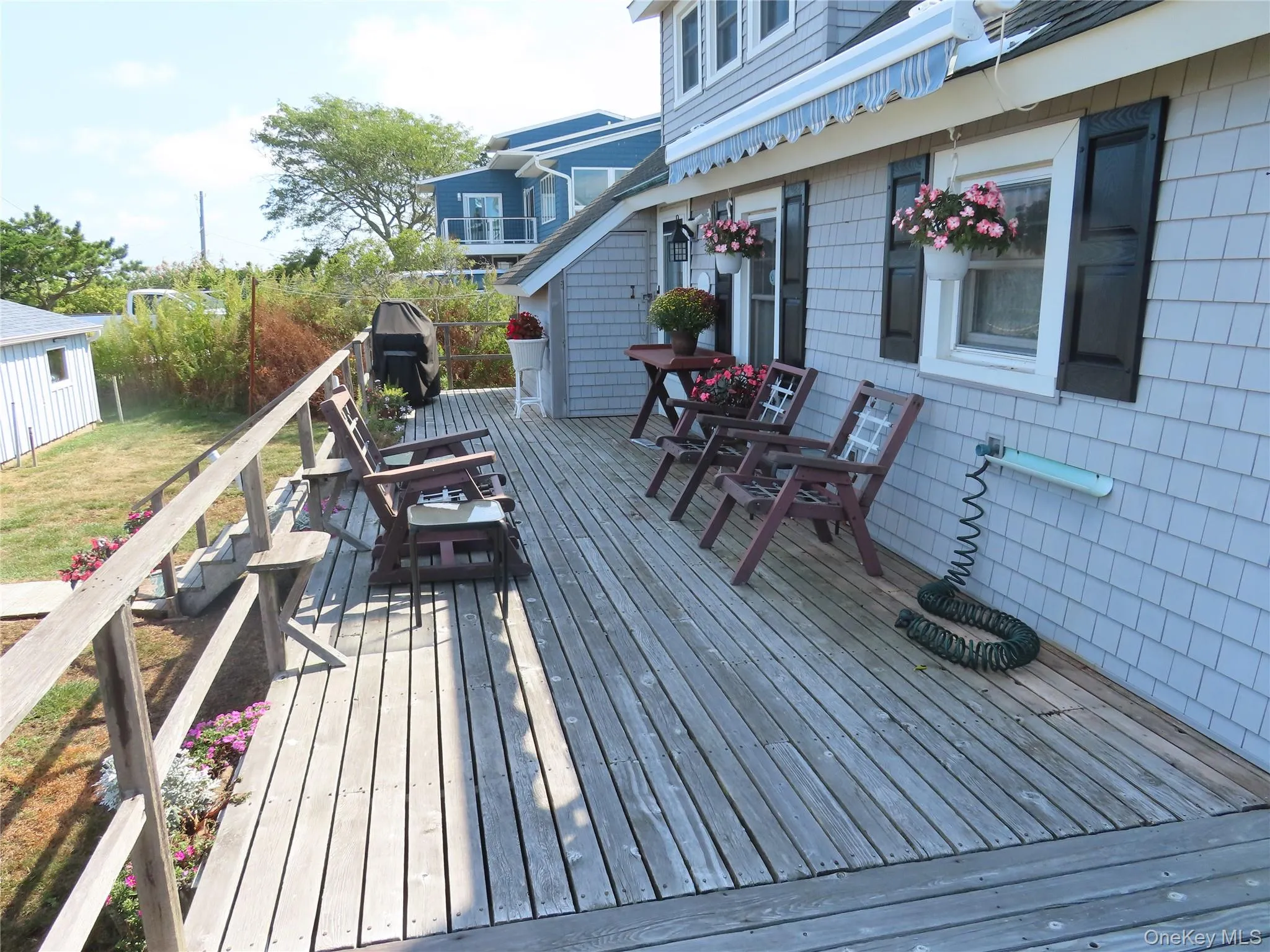 Deck featuring a lawn Deck featuring a lawn