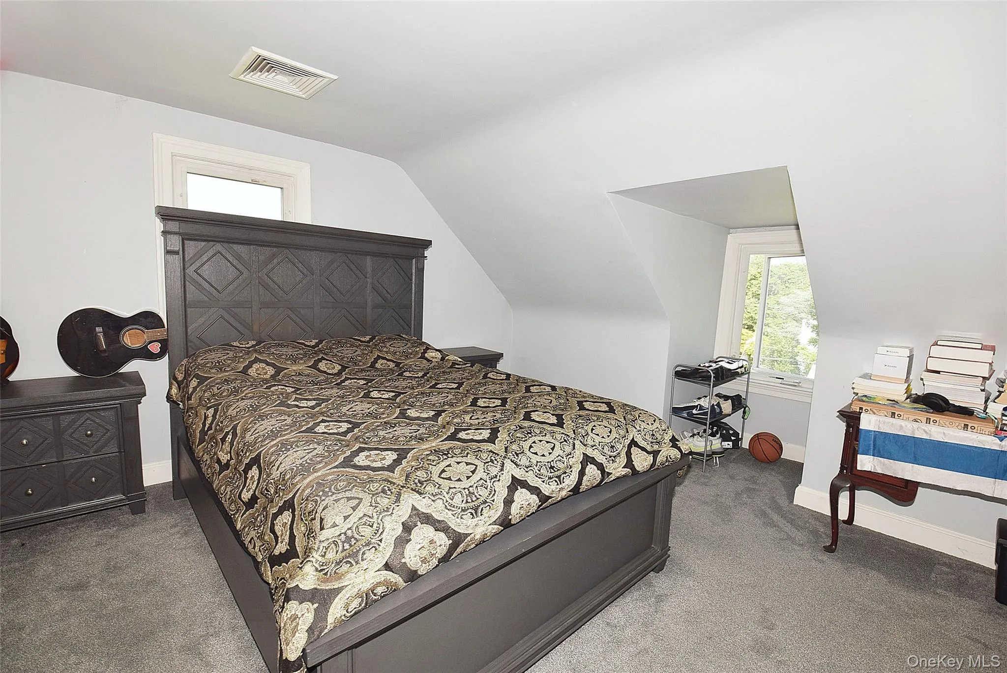Sloped ceilings, window alcoves, and light gray wall paint Sloped ceilings, window alcoves, and light gray wall paint
