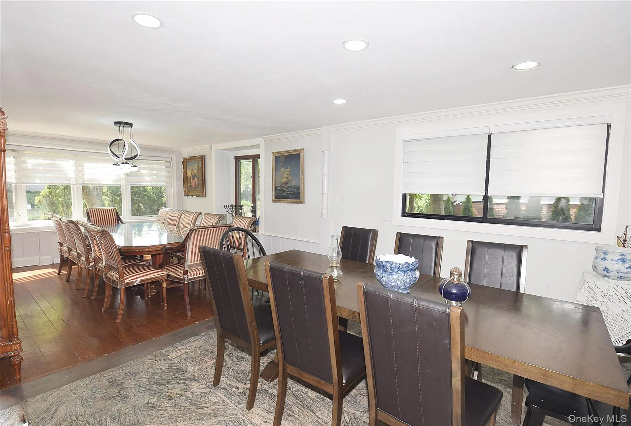 Expansive dining area featuring recessed lighting and wood-finish flooring Expansive dining area featuring recessed lighting and wood-finish flooring
