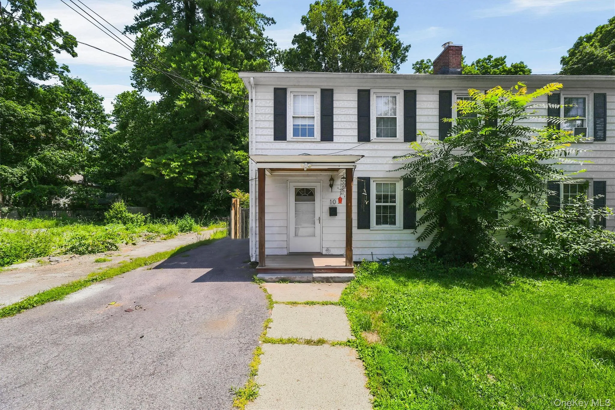 Digitally decluttered exterior image. Items currently remain on the property and are not shown. Digitally decluttered exterior image. Items currently remain on the property and are not shown.