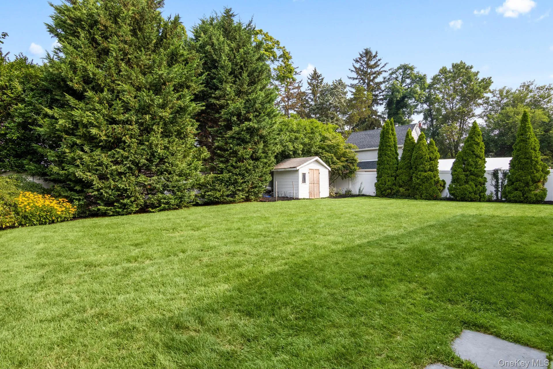 Fully Fenced Rear Yard With Mature Plantings Fully Fenced Rear Yard With Mature Plantings