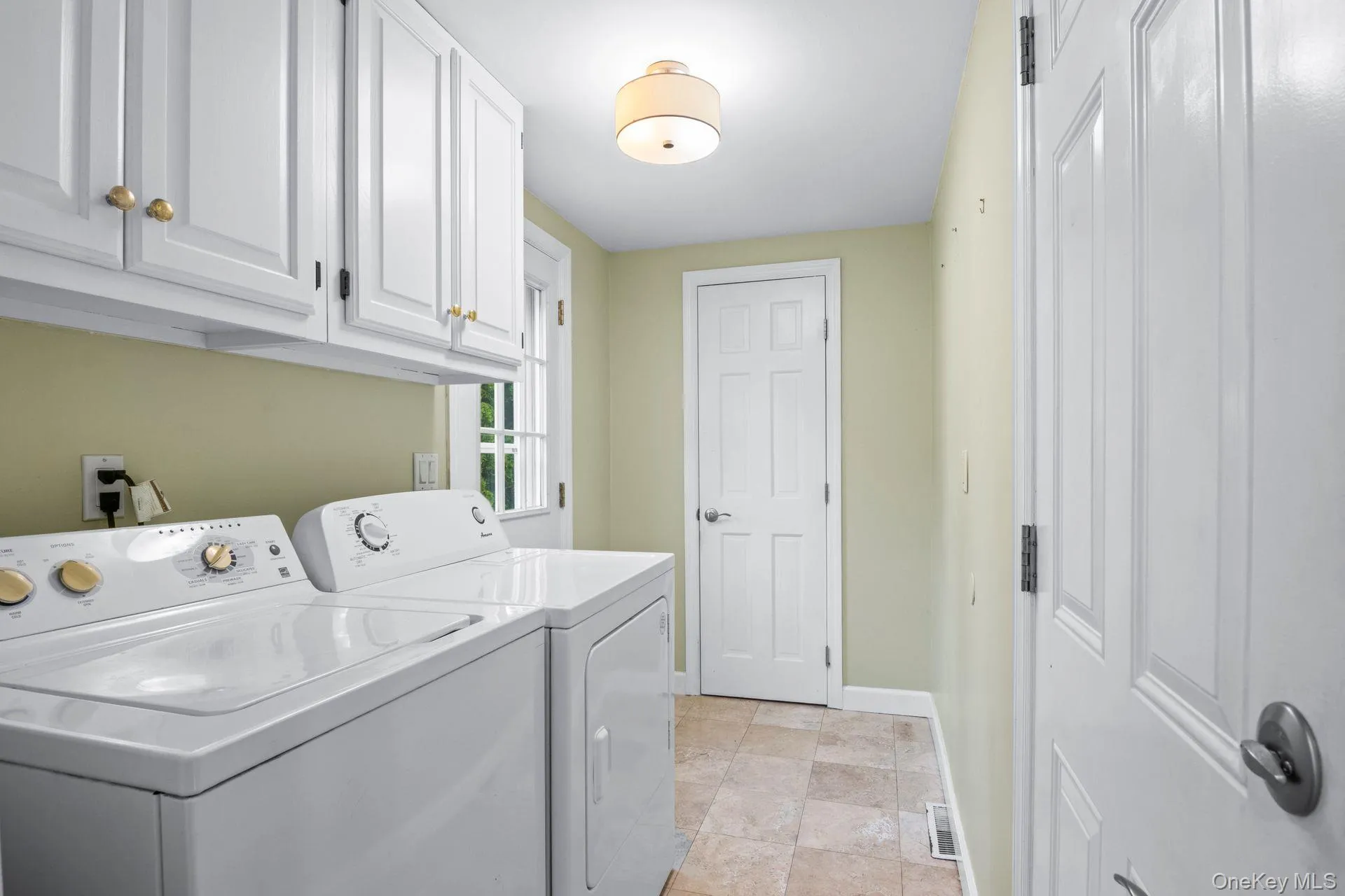 Laundry With Entrace To Garage & Rear Yard Laundry With Entrace To Garage & Rear Yard