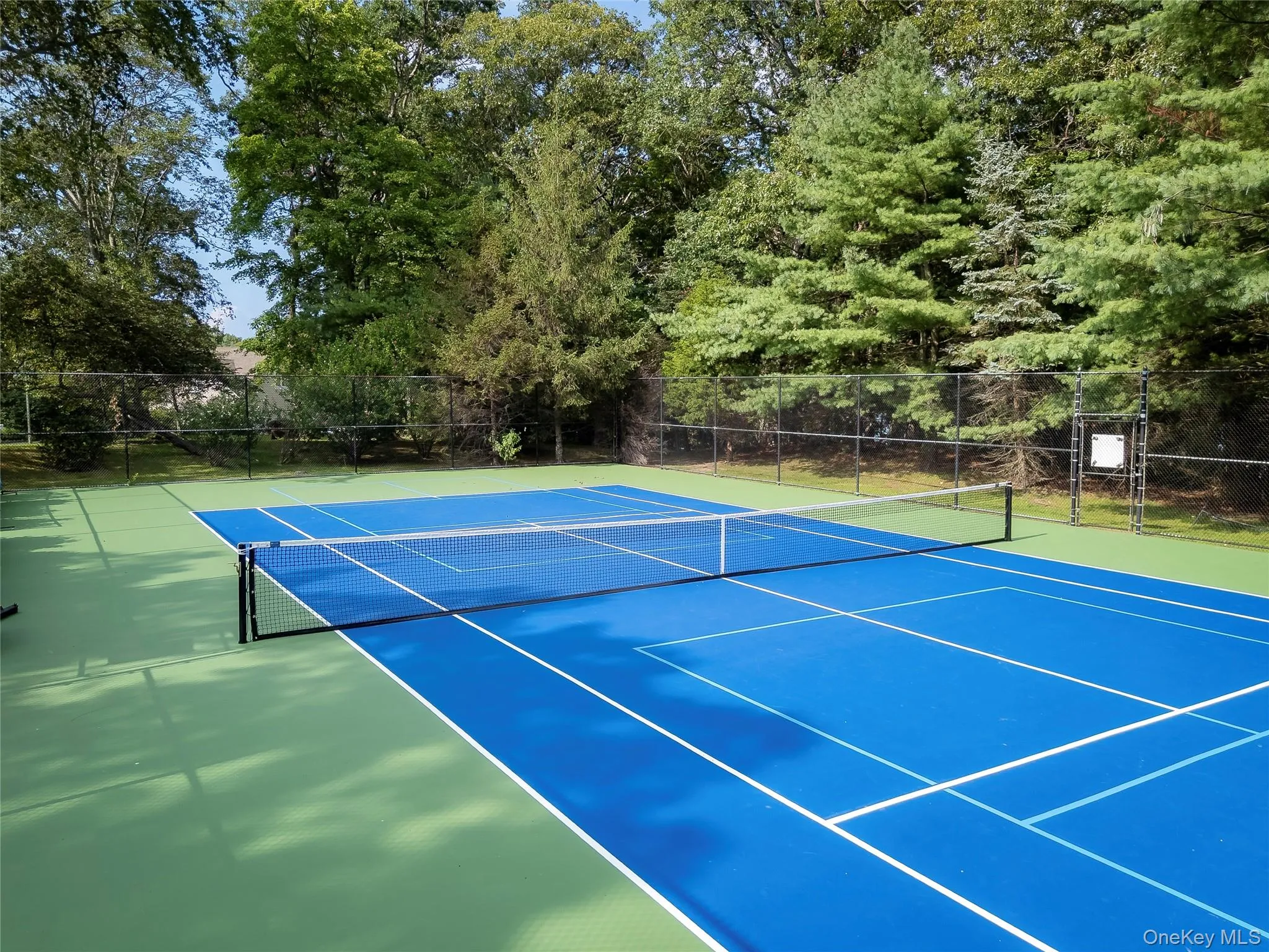Newly resurfaced Village tennis court Newly resurfaced Village tennis court