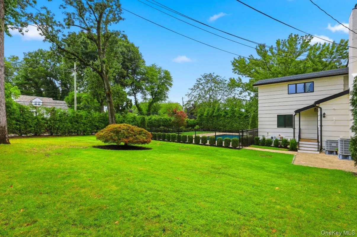 Maintained backyard offering a lush level lawn, mature landscaping, and plenty of space for outdoor recreation and relaxation. Maintained backyard offering a lush level lawn, mature landscaping, and plenty of space for outdoor recreation and relaxation.