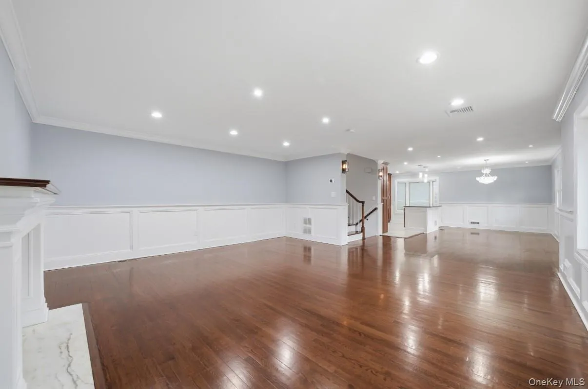 Expansive open-concept living space featuring beautiful hardwood floors. Expansive open-concept living space featuring beautiful hardwood floors.