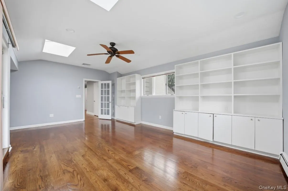 Built-in shelving and cabinetry suitable as a sitting room, office or private lounge. Built-in shelving and cabinetry suitable as a sitting room, office or private lounge.
